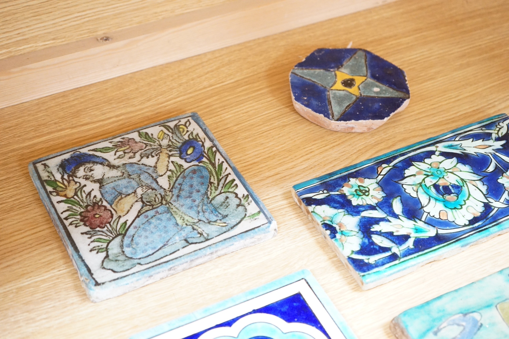 Six various Iznik and Islamic tiles, largest 25 x 22cm. Condition - fair